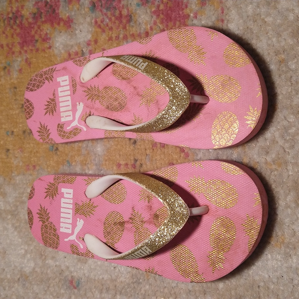 Pink and gold Puma flip flops